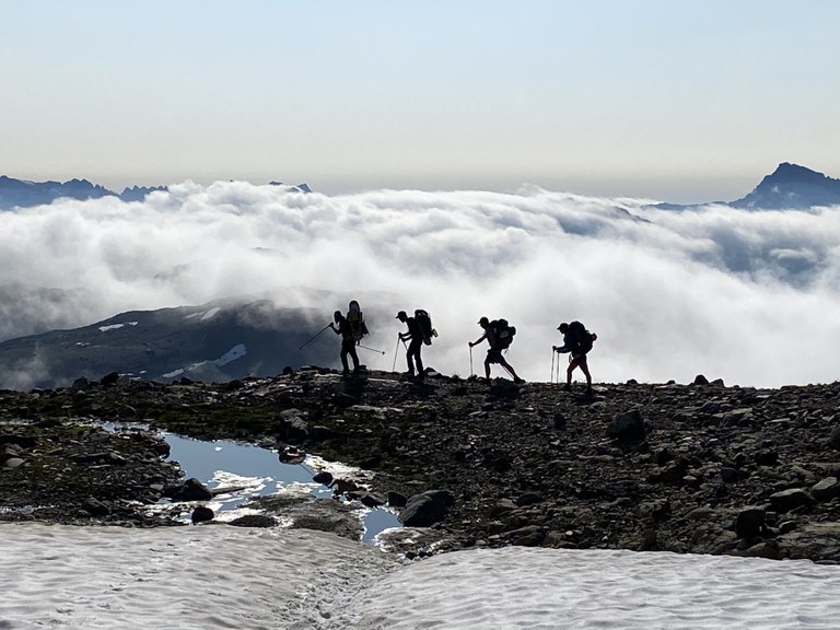 Hikers descending to Glacier Basin from Glacier Peak
