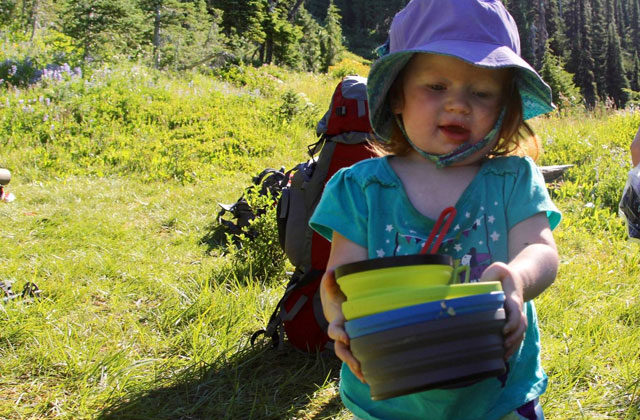 Vivian helps with dinner dishes in camp. Photo courtesy Lorelei Felchlin.