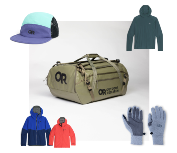 A tan duffle bag is in the center with a pair of gloves, a long-sleeved hooded shirt, a sun cap and several rain jackets around the sides.