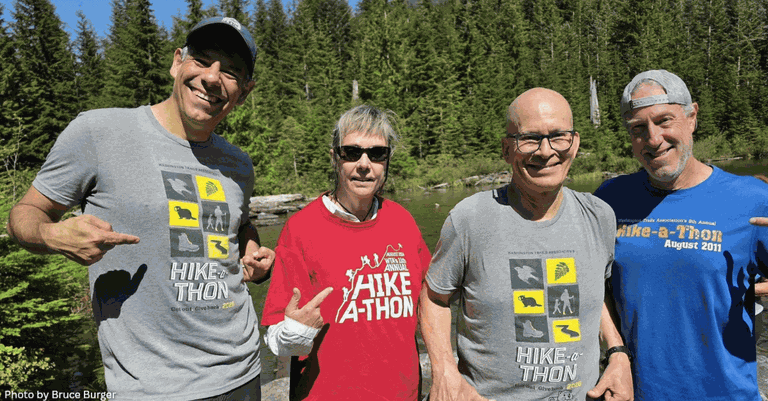 A series of photos of Hike-a-Thon participants wearing the grey event T-shirt. They are in different size groups on a variety of trails, including mountains, neighborhood parks and forests. Photos by Photos by Bruce Burger, Michele Hancock, Diana Chin, Tanya Pechenov, Craig Romano, Mani Dhami and Karen Bean.