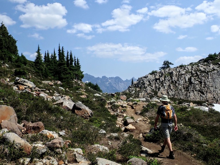 Hiker heading out of Gothic Basin. Photo by Chelsey Morar.