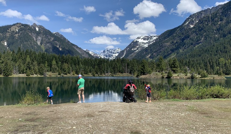 Family playing at Gold Creek Pond. Photo by Sasha Dae A family plays near Gold Creek Pond. Photo by Sasha Dae.