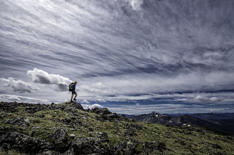 Horseshoe Basin. Photo by Mike Warren. Hiker along an open ridge at Horseshoe Basin.