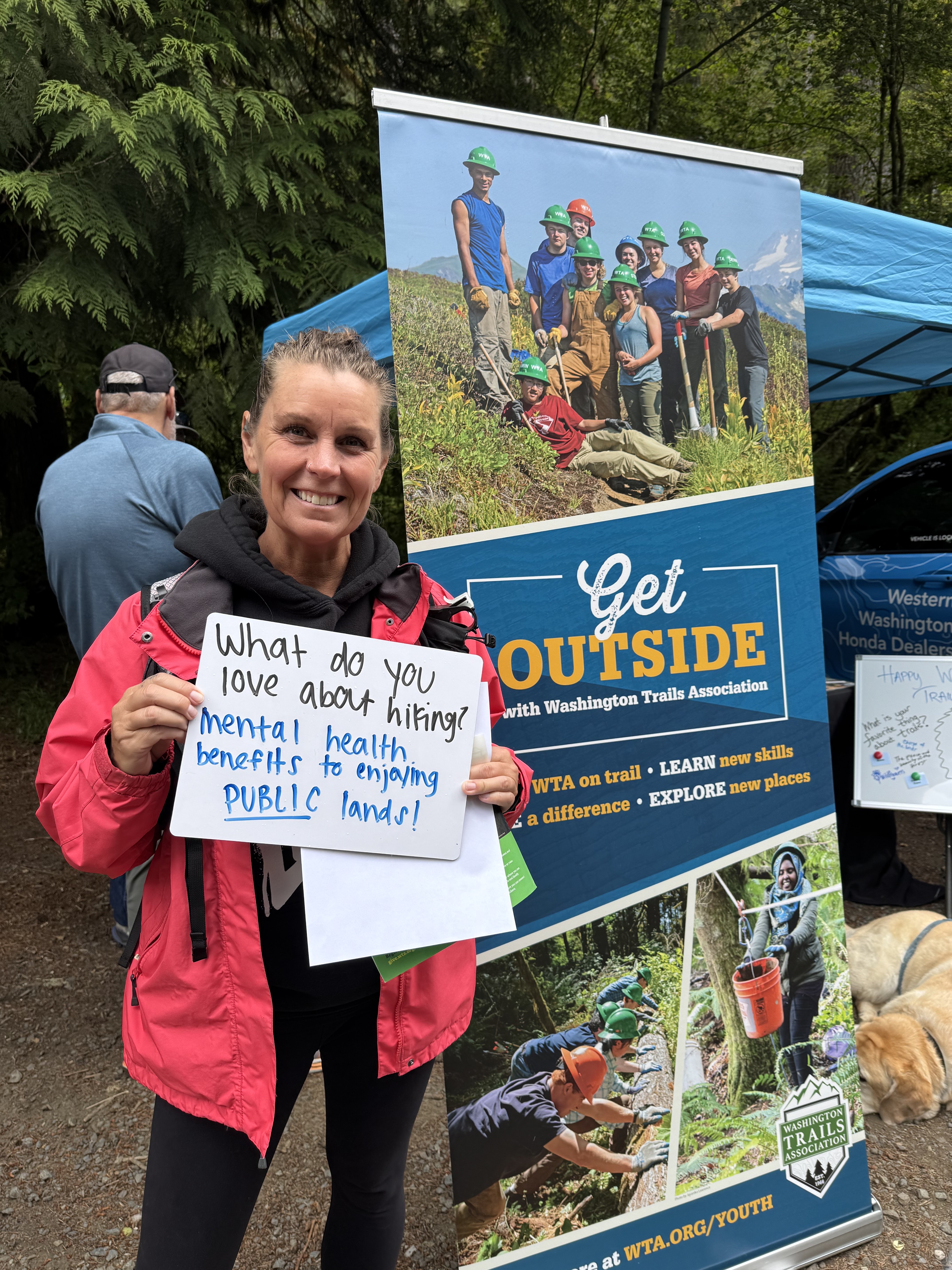 Hiker holds sign Hiker holds sign