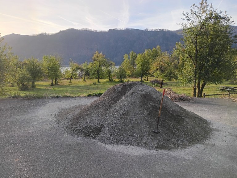 A pile of gravel sits in the parking lot of the St. Cloud accessible trail. 