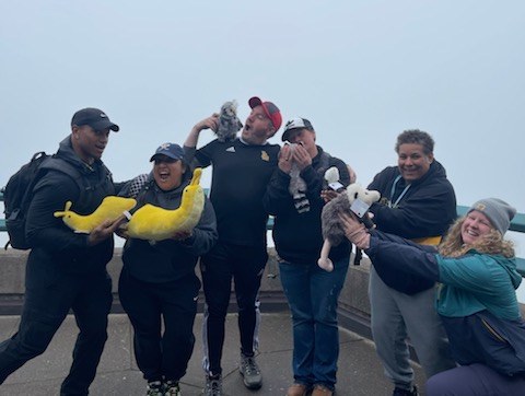 Group of educators enjoying their time with stuffed animals at their Mount Saint Helens Volcanic school outing