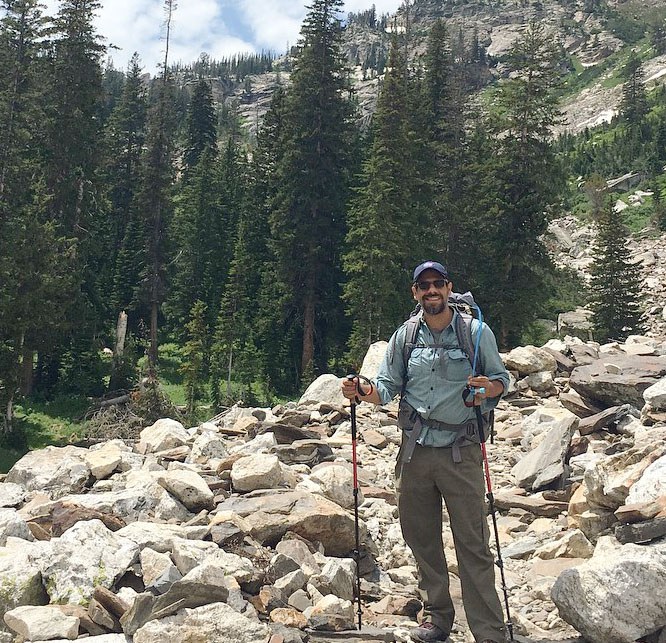 Jaime Loucky with backpack enjoying the outdoors.