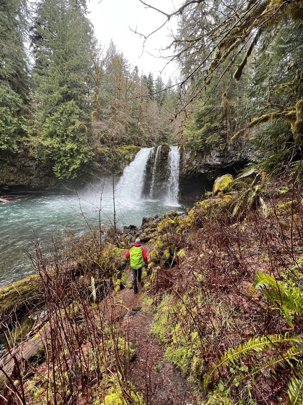 A hiker on the trail with Kalama Falls in front of them. Photo by BeaverDawg.