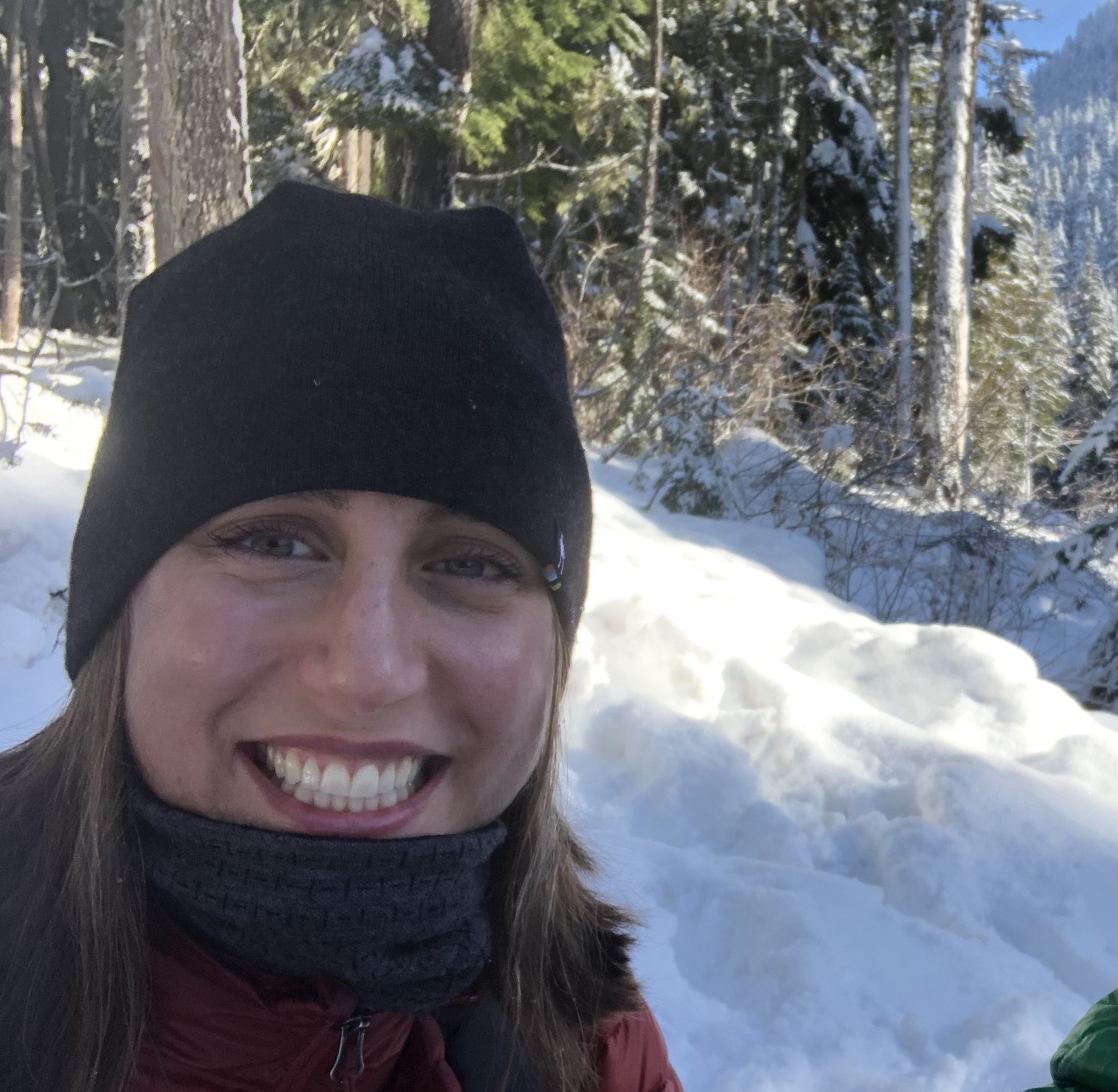 Leah Dobey Leah Dobey, smiling for a selfie with snow in the background.