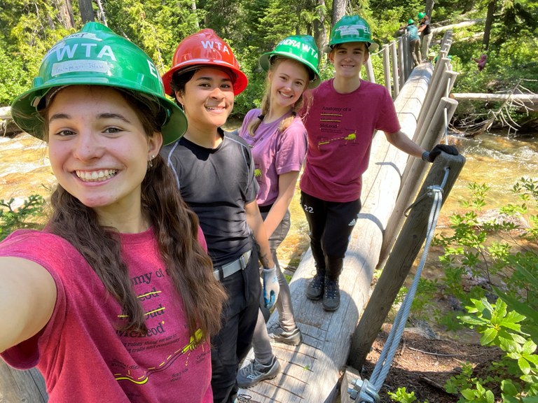 Youth Volunteer Vacation trail crew taking a selfie on a bridge at Lone Fir. Photo by Charlie Lavides.