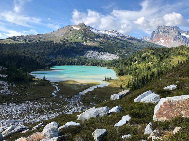 A vivid green-blue lake viewed from above.