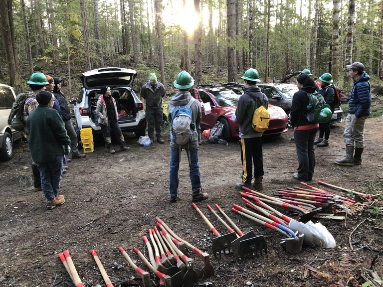 A morning trailhead briefing before heading out on trail.