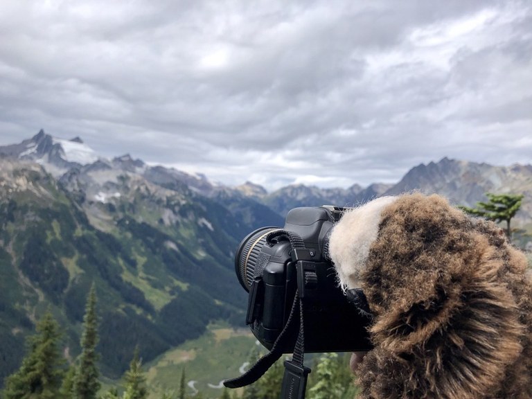 River taking a photo of the view.