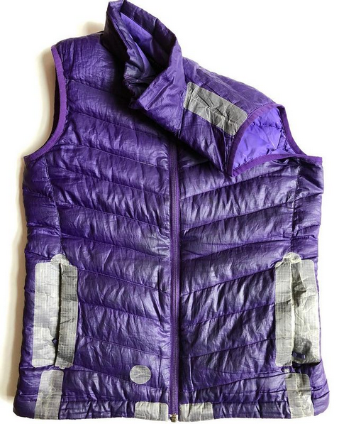 Purple down vest patched with Tenacious Tape. Photo by Michele McNulty Finnegan via Instagram