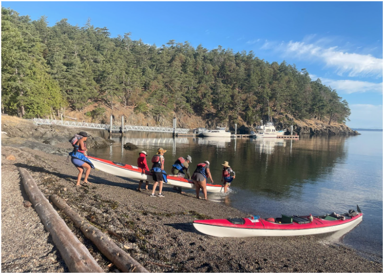 A group gets ready to go kayaking.