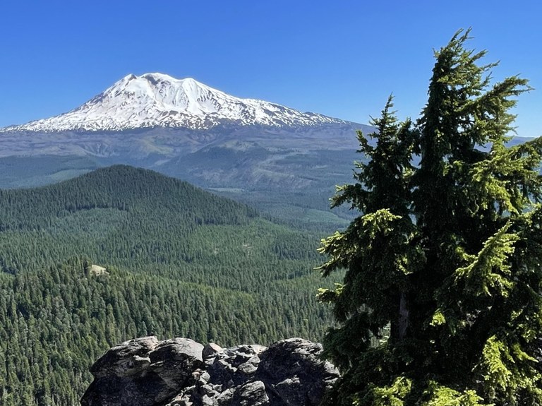 View of Mount Adams on a clear bluebird day from the rocky Sleeping Beauty Peak. Photo by KASMITH07.