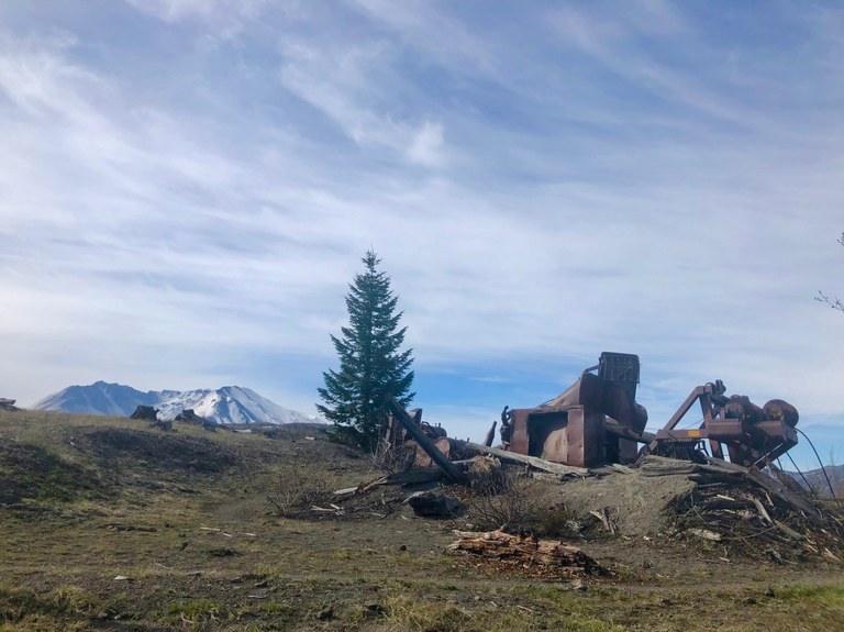 South Coldwater Trail. Photo by VentureBold. Old mining equipment and Mount St. Helens from the South Coldwater Trail. Photo by VentureBold.