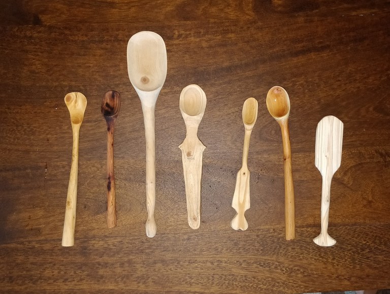Seven carved wooden spoons.