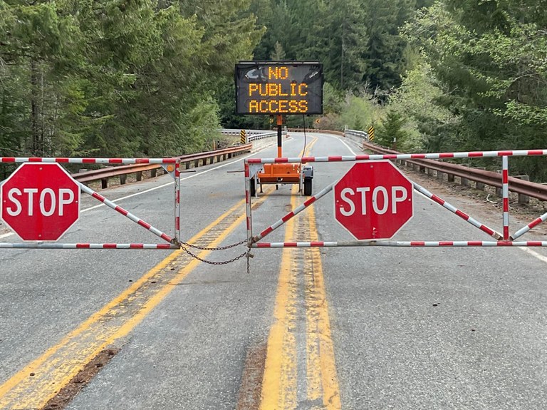 Gates closed and a sign that says "No Public Access" on Highway 20 (North Cascades Highway). Photo courtesy of the Washington State Department of Transportation (WSDOT).