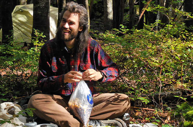 Volunteer with trail mix by Anna Roth