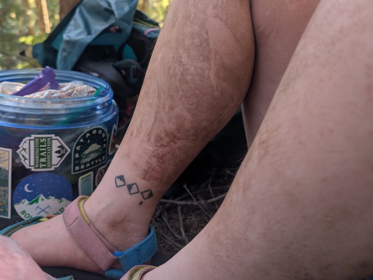 A hiker's dirty legs, in need of a wet wipe bath. Photo by Vince Rhodes.