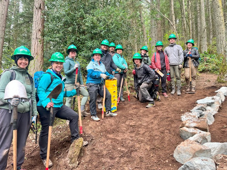 Trail crew. Photo by Juliet Evans. Trail crew group photo next to a rock crib wall. Photo by Juliet Evans.