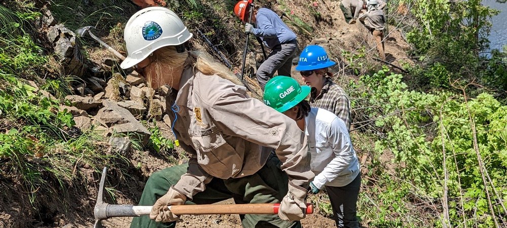 USFS on trail. Photo by Dawn Rorvik. USFS trail workers and WTA volunteers working on the Chelan Lakeshore trail. Photo by Dawn Rorvik.