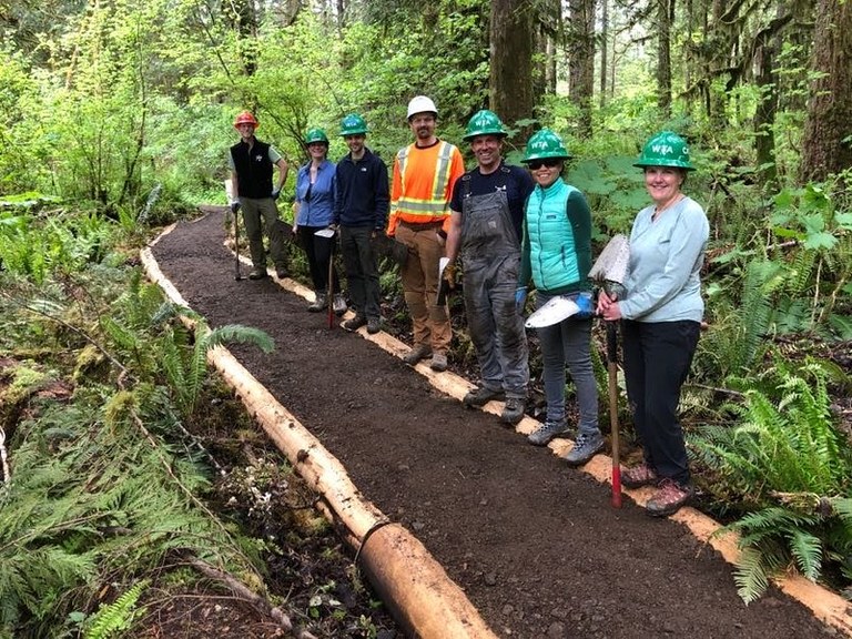 Volunteers on newly repaired Horseshoe Bend Trail. Photo by Mike Bellis Volunteers standing on a recently repaired section of graveled trail. Photo by Mike Bellis.