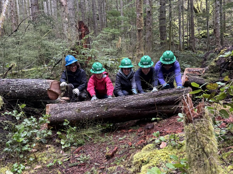The ELP crew removing a large log from the Wallace Falls trail together. Photo by Angelic Friday.