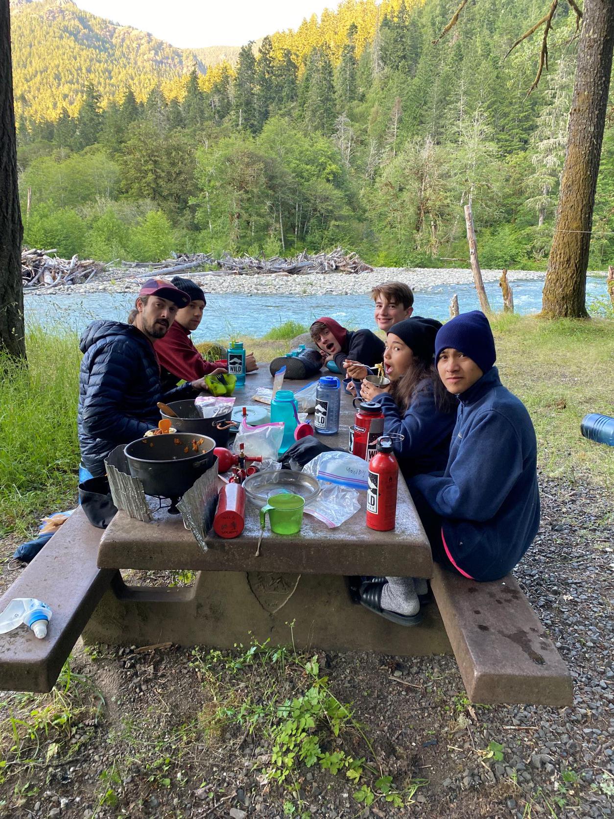 Wild Society campers share a meal on their 6-day backpacking trip to the Elwha River Valley. Photo by Harper McFadden.
