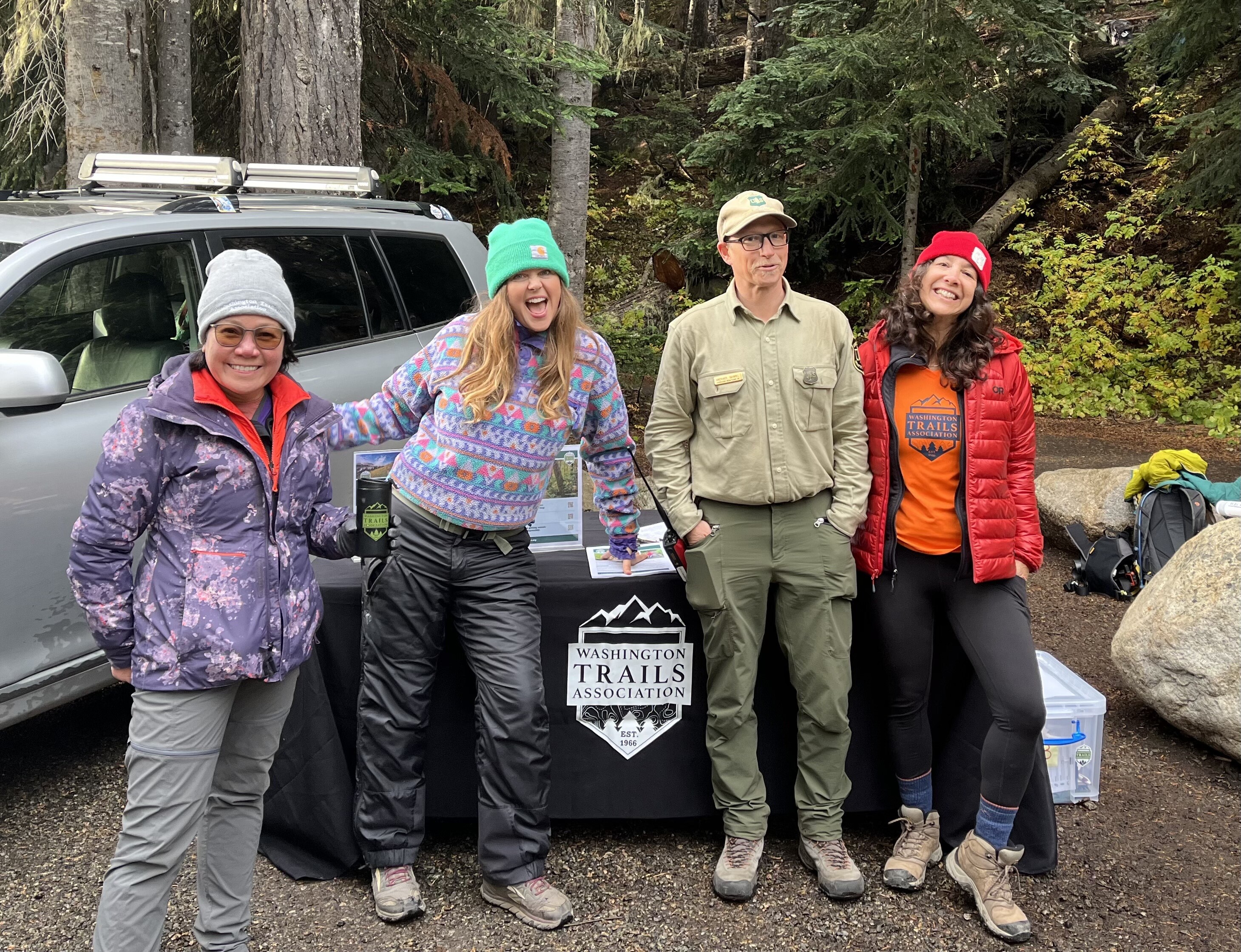 WTA ambassadors and a Forest Service employee at Heather Maple Pass in fall 2024