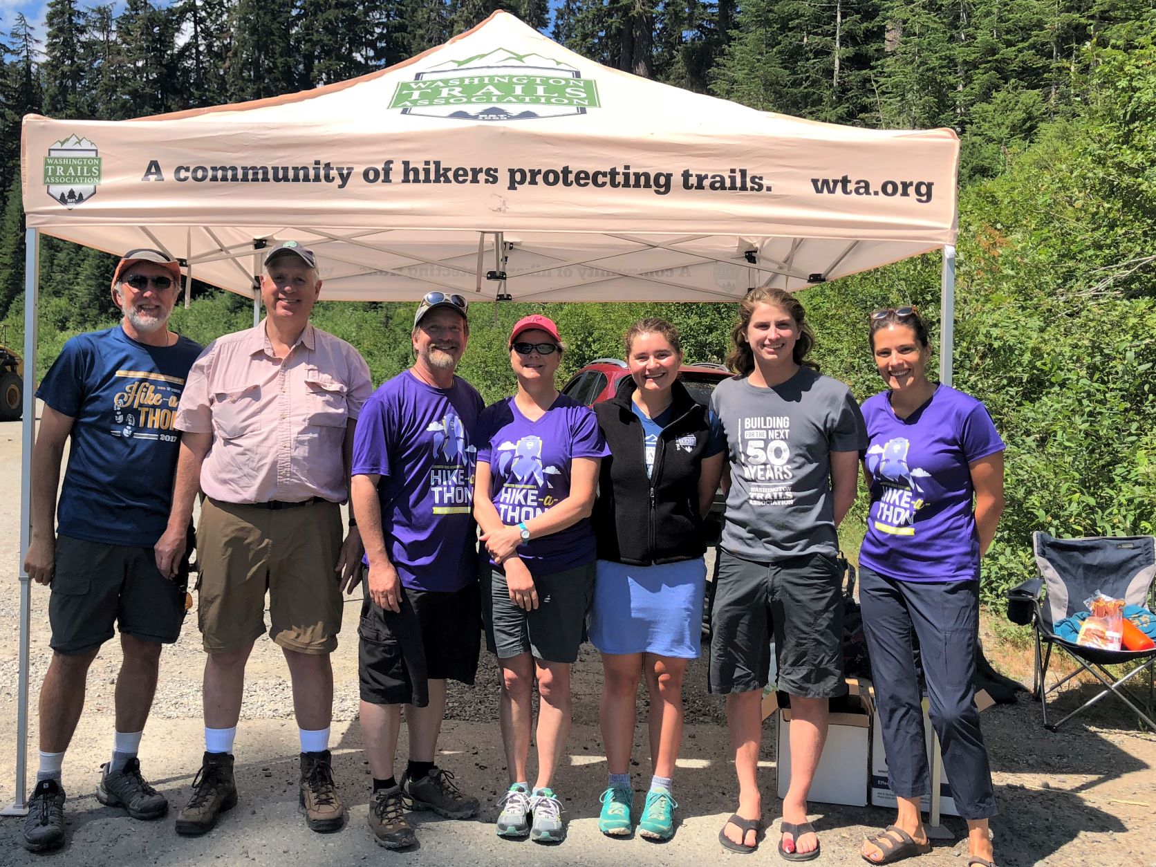 WTA's CEO Jill Simmons and WTA volunteers greeting hikers on Washington Trails Day at the Snow Lake trailhead.