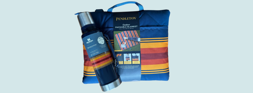 Photo of packable blanket and thermos. Both Pendleton themed.