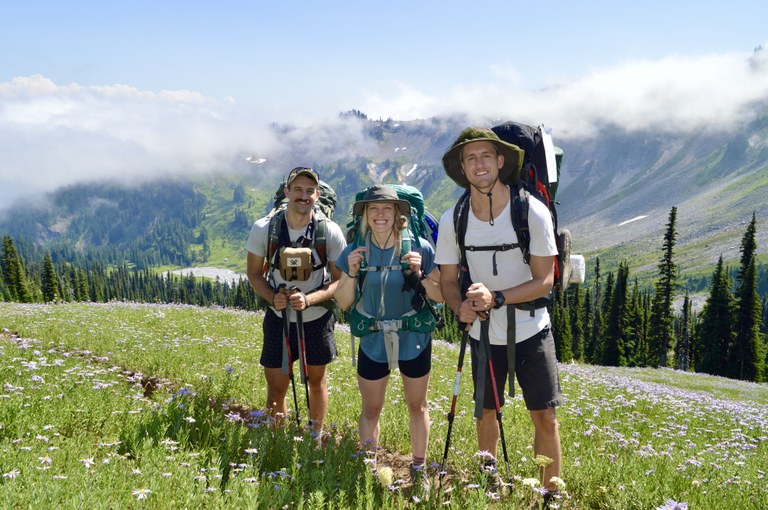 Three hikers smile before they head into Indian Bar. Photo by Karen Retz. 