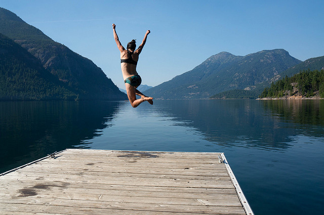 Diving into Ross Lake for a swim after a long day on Desolation Peak. Photo by David Baxter
