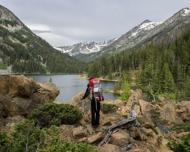 A hiker looks down on Eightmile Lake. Photo by Ken Peterson. 