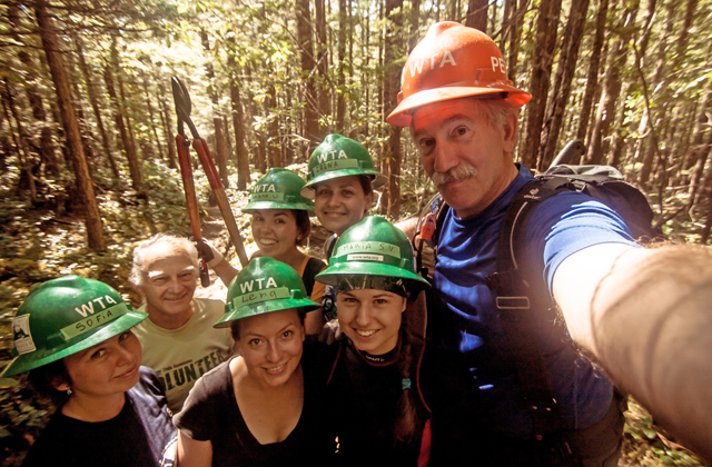 The happy crew takes a break during their work party. Photo by Peter Bose. 