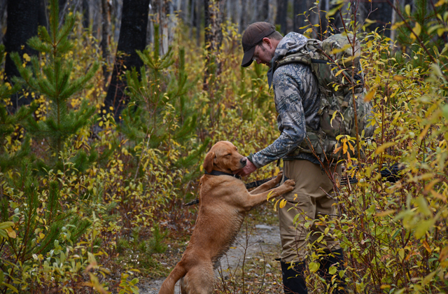 Gregg often hunts with his dog, Bode. Photo by Anna Roth. 