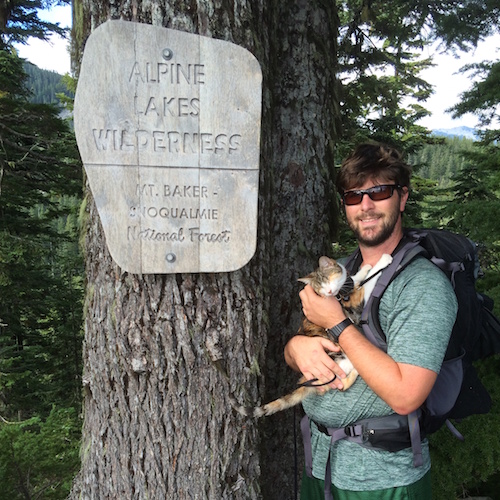 Honey Bee takes time for cuddles with one of her favorite hiking partners, owner Jonathan Ursin.