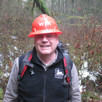 Les Baddgor takes a break on the Whipple Creek Trail. Photo by Ryan Ojerio. 