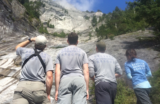 Rescuers discuss the safest route to ascend Infinite Bliss.